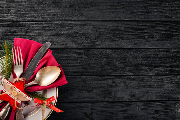 istock Christmas table decoration. Christmas dinner plate, cutlery decorated festive decorations. Winter holidays. Christmas card. Free space for your text. Merry Christmas, Happy New Year. 875758668