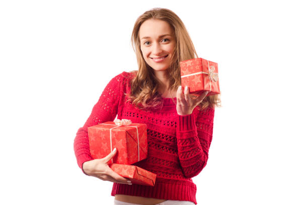 istock Young beautiful woman in hands holding a holiday gift 875758928