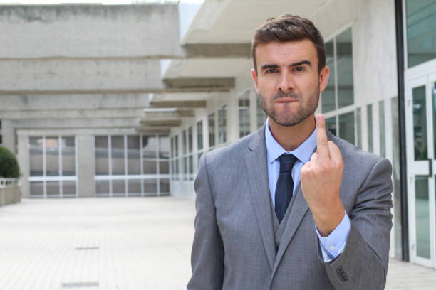 istock Moody businessman showing a middle finger 875759900
