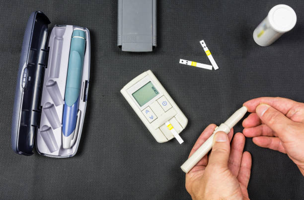 istock Hand finger needle strokes to measure sugar level. 875768258