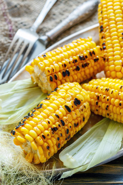 istock Sweet corn grilled with sea salt. 875769830