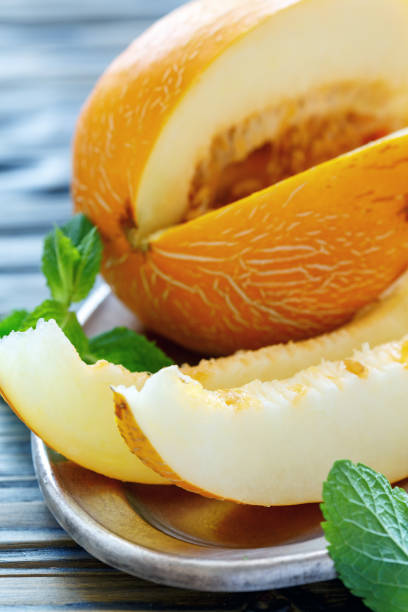 istock Fresh ripe melon on a dish closeup. 875770616