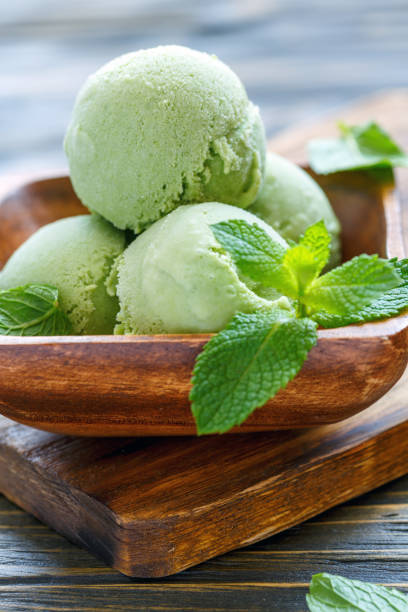 istock Homemade mint ice cream and mint leaves. 875774356