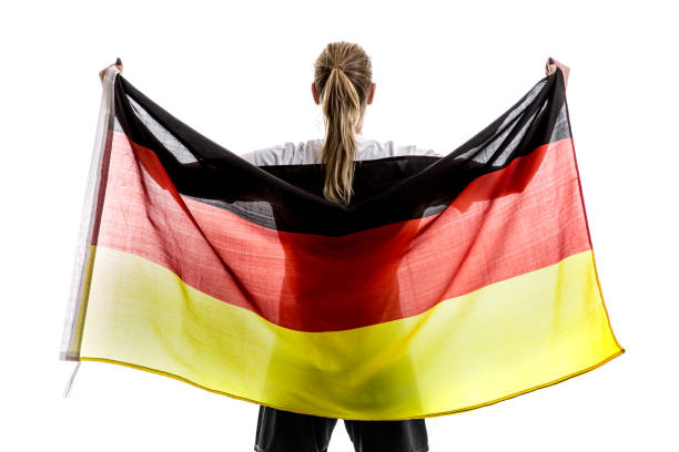 istock German female athlete / fan celebrating on white background 875780762