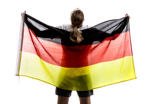 istock German female athlete / fan celebrating on white background 875780766