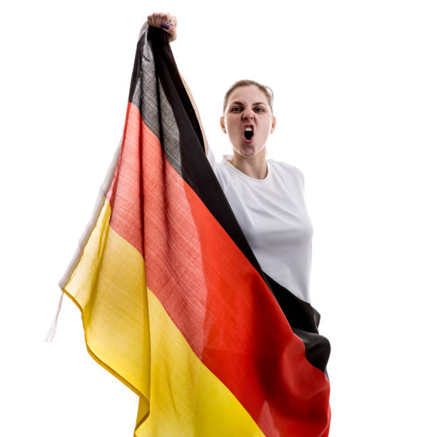 istock German female athlete / fan celebrating on white background 875780790