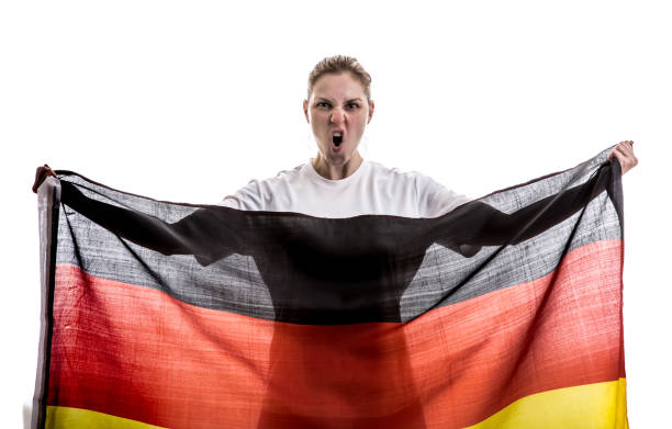 istock German female athlete / fan celebrating on white background 875780840