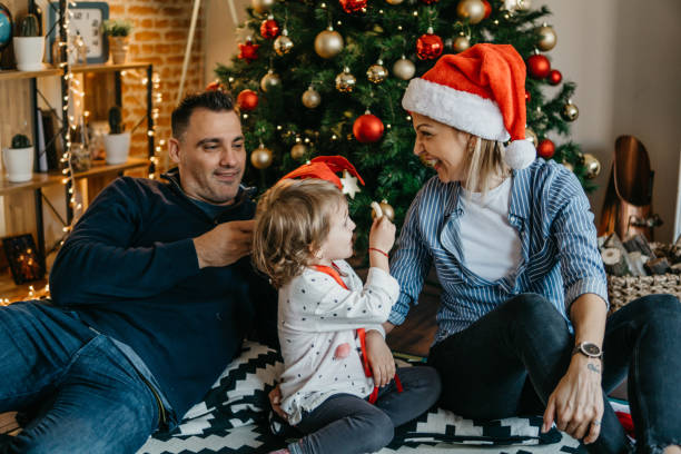 istock Happy family have fun in front Christmas Tree 875781818