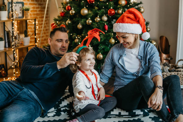 istock Happy family have fun in front Christmas Tree 875781992