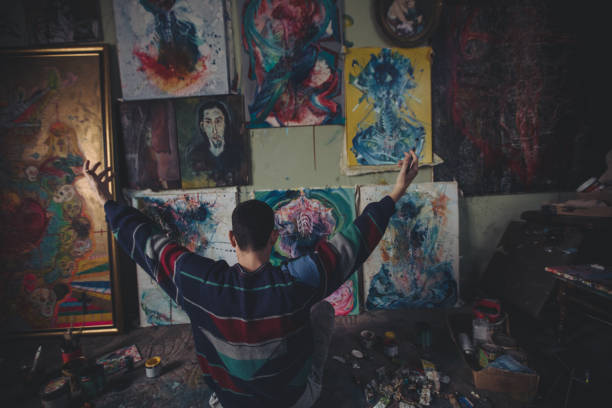 istock Young artist working on a painting in the studio 875788914
