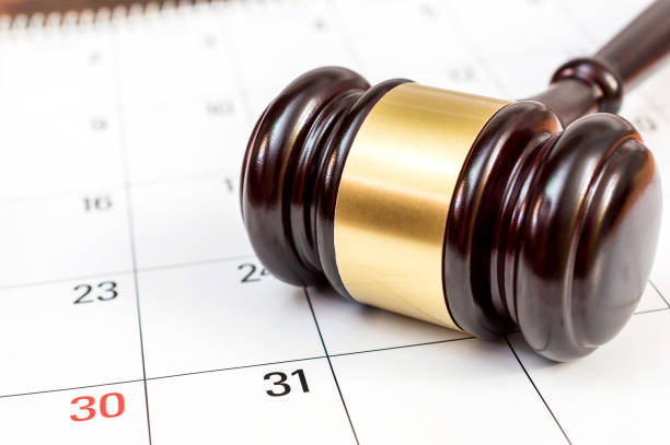 istock Judge's gavel on the calendar. 875789228