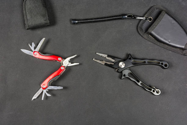 istock Pliers and folding multifunctional tool for anglers. 875789638