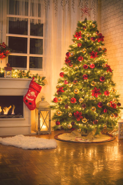 istock Christmas Tree Near Fireplace at Home 875792820