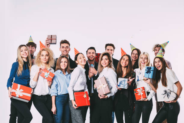 istock Group of people having a party with gift boxes. 875801284