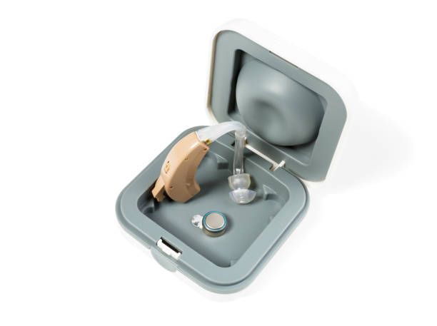 istock Hearing aid in a box on a white isolated background 875810096