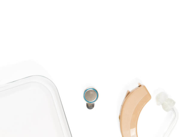 istock Hearing aid with box not fully shown on white isolated background 875810318