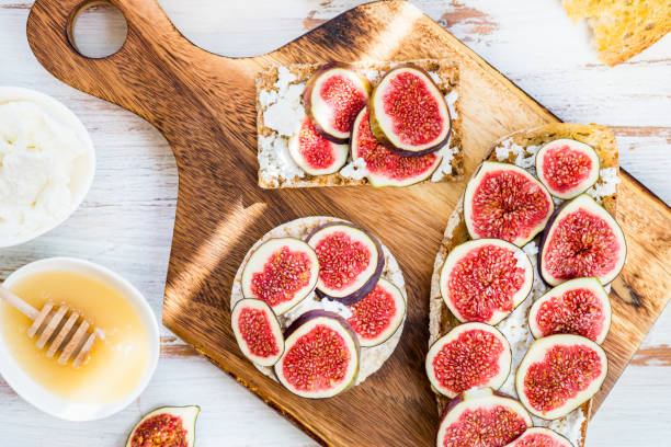 istock Healthy crackers and toast with figs and ricotta cheese 875812354