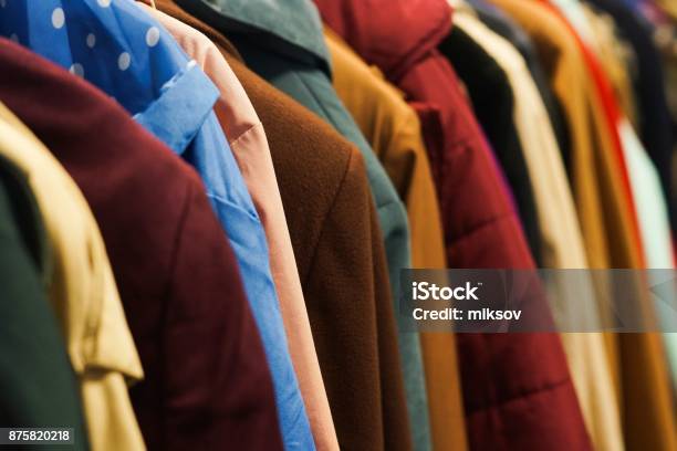 Colourful Coats In The Charity Shop Stock Photo - Download Image Now - Coat - Garment, Clothing, Charitable Donation