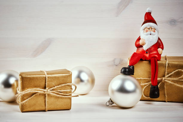 istock Christmas decorations on a wooden table with santa 875826450