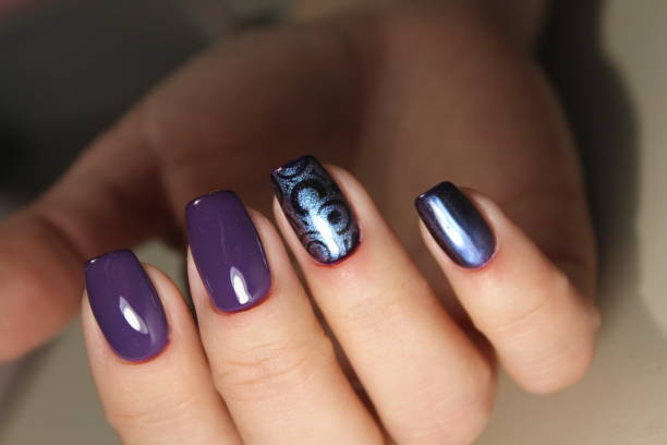 istock Manicured nails Nail Polish art design. 875826584
