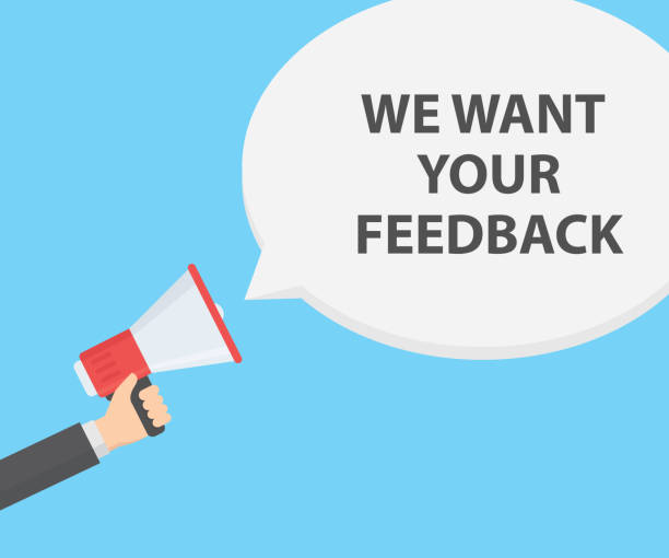 istock Hand holding megaphone and speech bubble. We want your feedback. Business concept 875831510