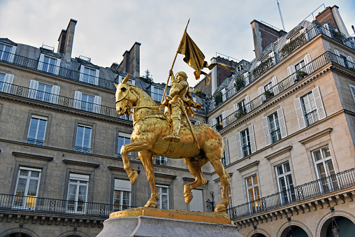 Paris, France -November 2017 , place des Pyramides a golden statue of Jeanne d'Arc on the back of her horse also gold covered