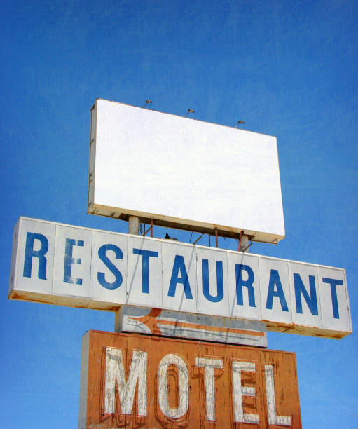 aged and worn neon motel and restaurant sign