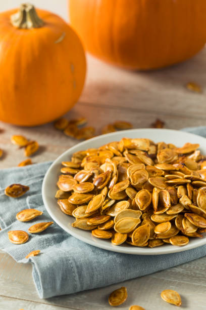istock Homemade Roasted Spiced Pumpkin Seeds 875854036