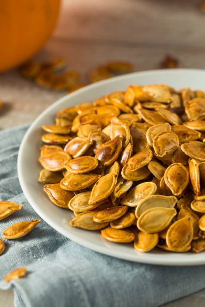 istock Homemade Roasted Spiced Pumpkin Seeds 875858556