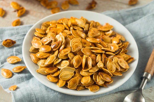 istock Homemade Roasted Spiced Pumpkin Seeds 875858598
