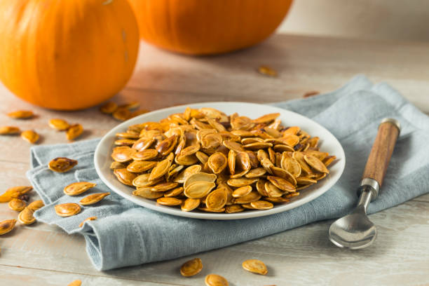 istock Homemade Roasted Spiced Pumpkin Seeds 875858772