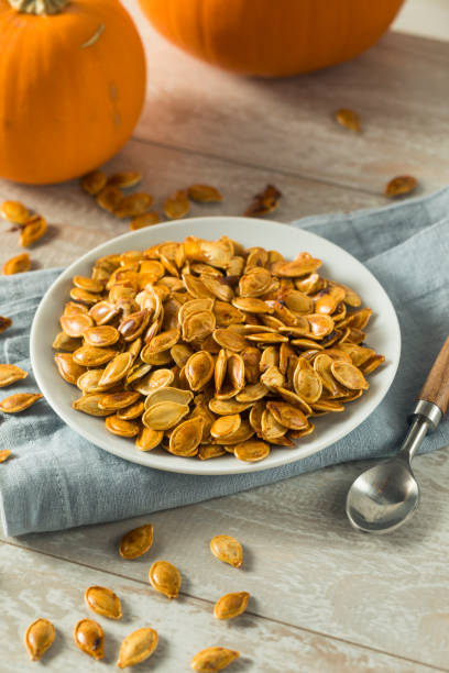 istock Homemade Roasted Spiced Pumpkin Seeds 875860968