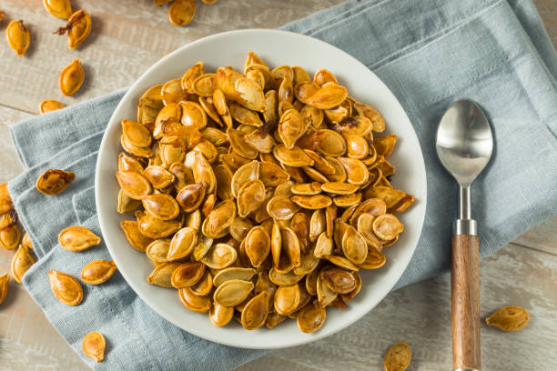 istock Homemade Roasted Spiced Pumpkin Seeds 875861012