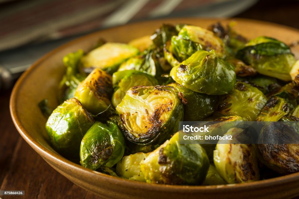 Homemade Roasted Green Brussel Sprouts Homemade Roasted Green Brussel Sprouts in a Bowl Brussels Sprout Stock Photo
