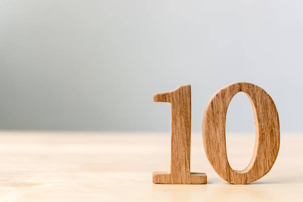 istock Wood sign number ten on table with copy space 875890542