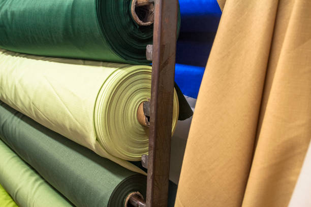 istock Fabric store with stacks of colorful textiles 875893070