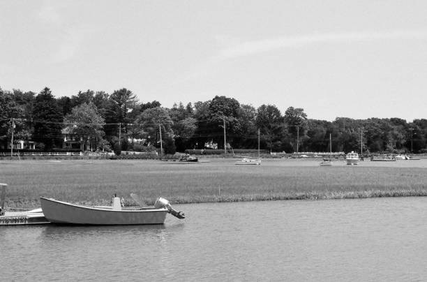 Sailboats and motor boats moored on an inlet to Duxbury Bay, MA. stock photo