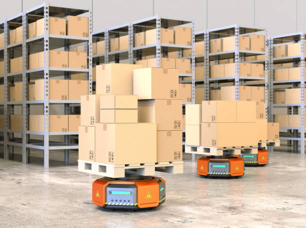 istock Orange robot carriers carrying pallets with goods in modern warehouse 875899052