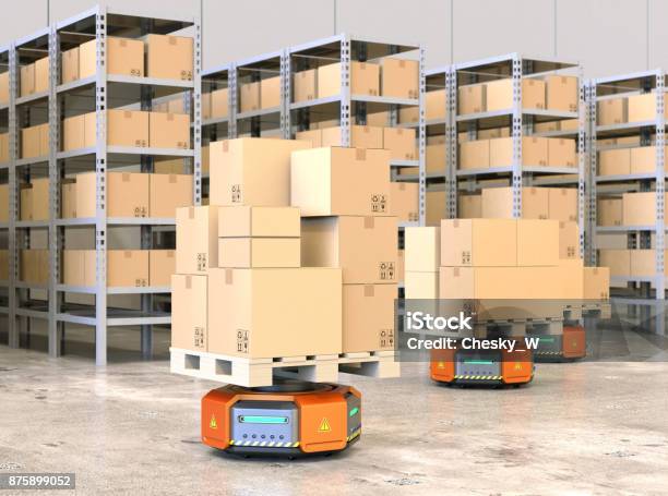 Orange Robot Carriers Carrying Pallets With Goods In Modern Warehouse Stock Photo - Download Image Now