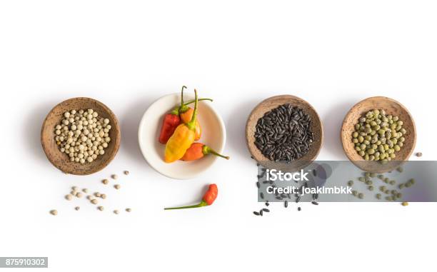 Spices And Herbs Placed In Bowls Isolated On White Background Stock Photo - Download Image Now