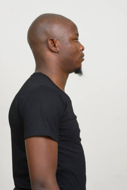 istock Young African man wearing black shirt against white background 875914842