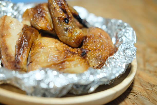istock The roasted chicken on wooden dish, Thai style 875917780