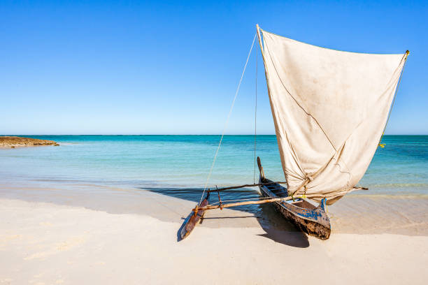 Outrigger canoe, traditional Vezo fishing boat beached in the lagoon of south-western Madagascar