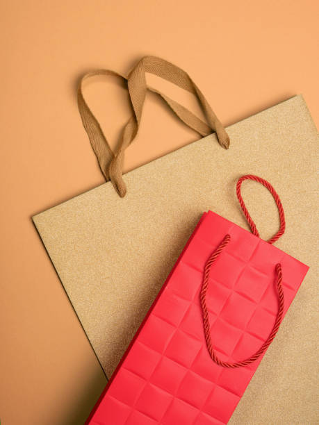 istock Gift bags on beige background 875929240