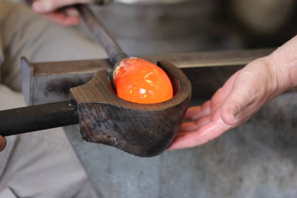 istock Molten glass on a rod for glass blowing macro 875932408