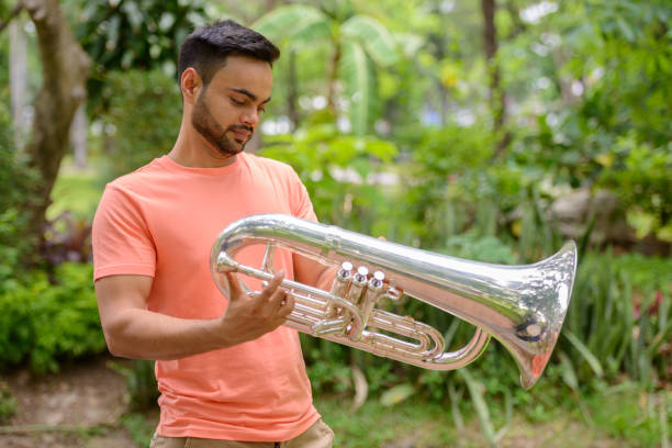 istock Young Indian man relaxing at the park 875936274
