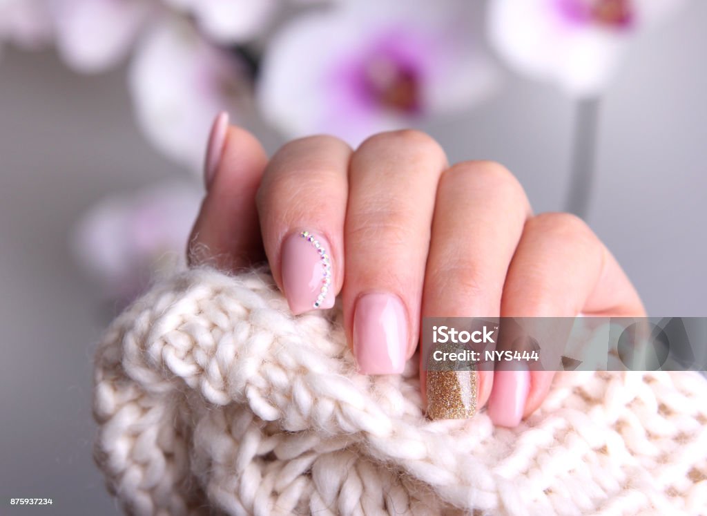 Nail design soft colors. Nail design soft pink color.Winter manicure. Design Stock Photo
