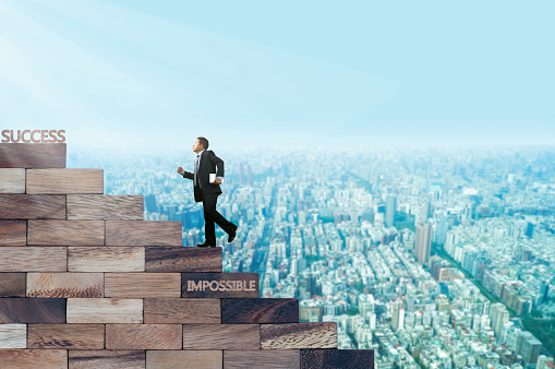 Businessman walking on wood stair, concept as success and development