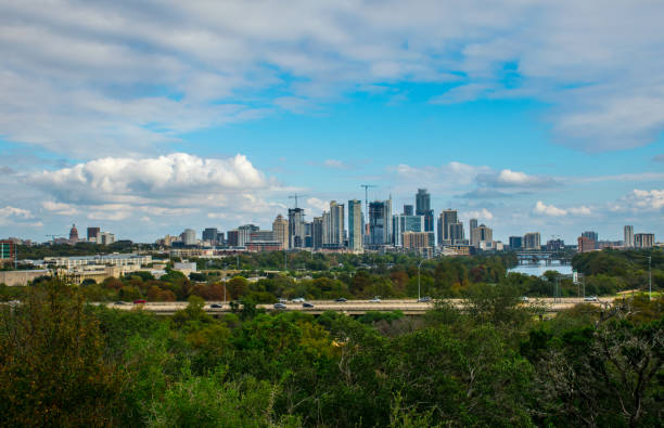 istock Austin Texas sunny afternoon with entire cityscape and dramatic dynamic cloudscape 875939960