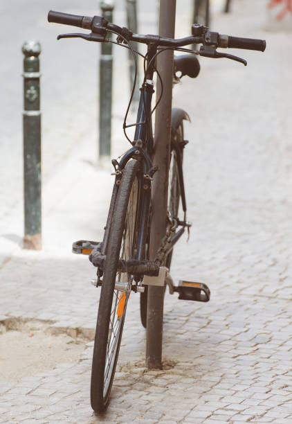 istock Old bicycle parked on the street. 875945032